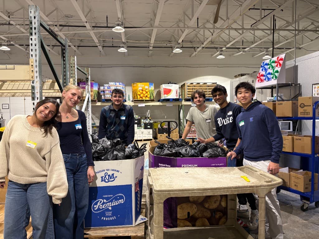Brothers volunteering together at a community food bank